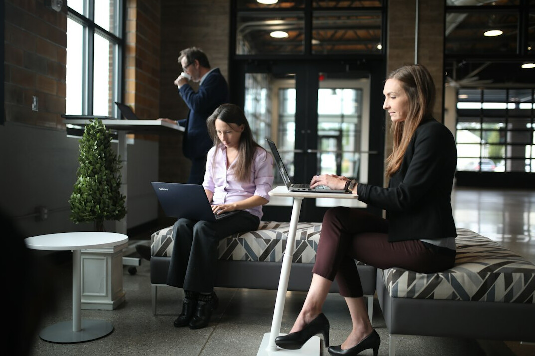 employees meditating in office